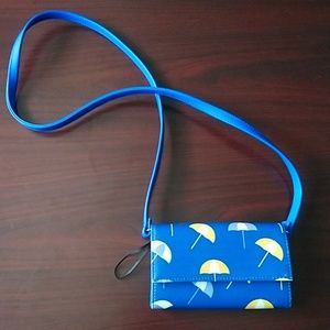 Blue umbrellas over the shoulder clutch